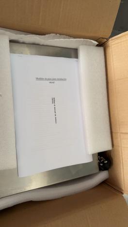 Packaged stainless-steel weighing controller and supplied document