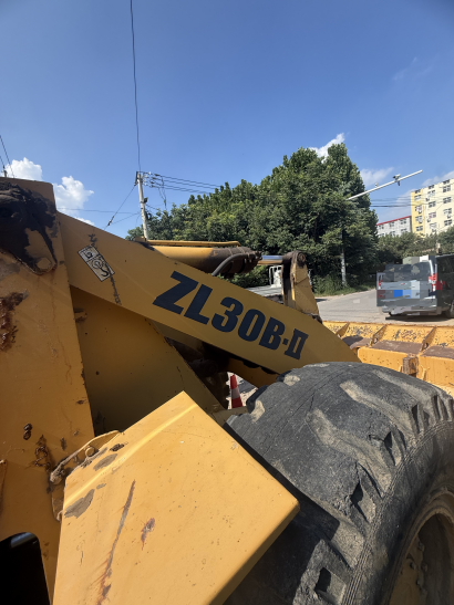 ZL30B-II marking on a loader arm at a roadside work site